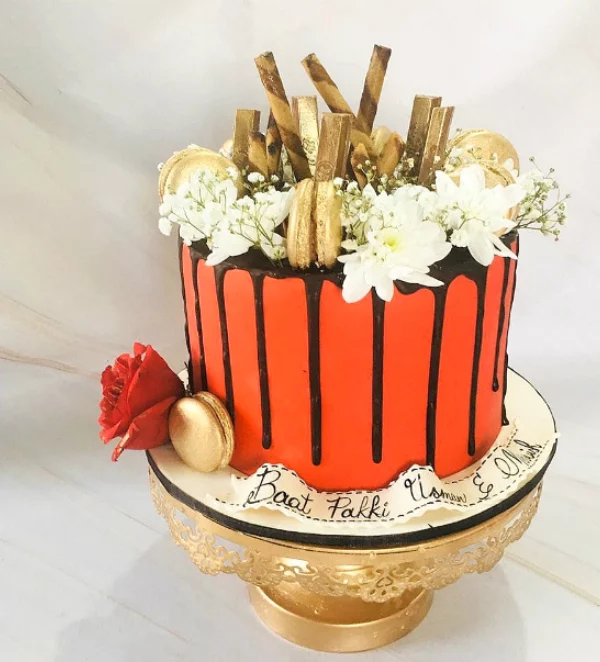 Red and Golden Macrons Cake