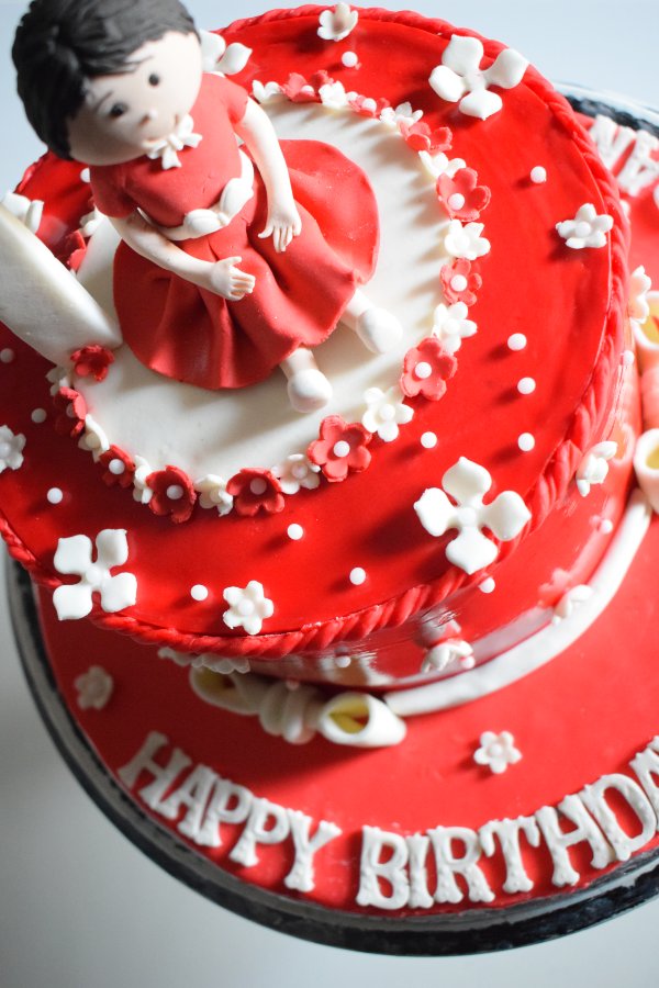 Doll in Red Cake