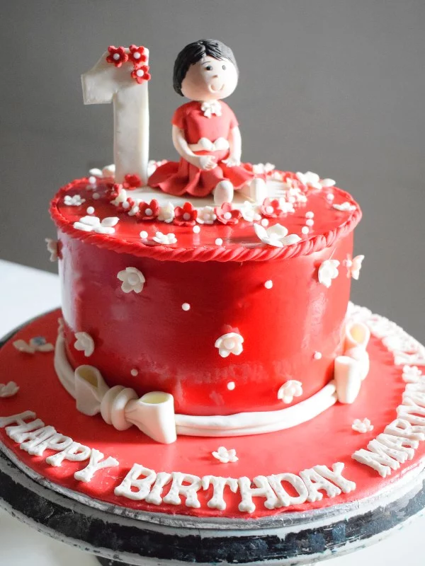 Doll in Red Cake